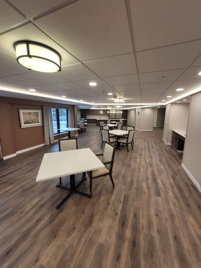 Spacious dining area with tables and chairs.