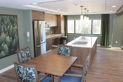 Bright, modern kitchen with dining table.