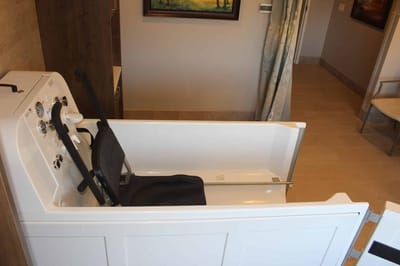 Accessible bathtub with chair in a bathroom