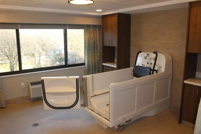 Spacious assisted living resident room with a bathtub.
