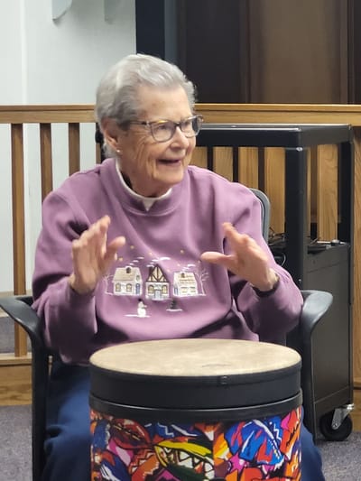 Senior woman participating in a group activity.