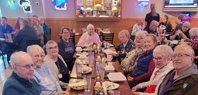 Group of seniors enjoying a meal together