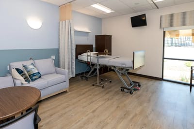 Cozy private resident room with a comfortable chair