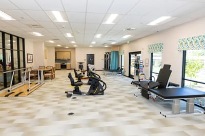 Interior view of a rehabilitation gym with exercise equipment