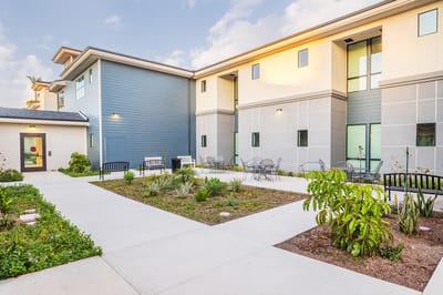 Outdoor space with benches and landscaping at the facility