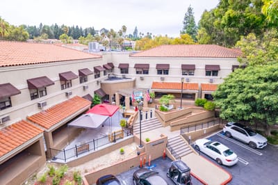 Aerial view of the Palm Terrace Healthcare entrance with outdoor seating