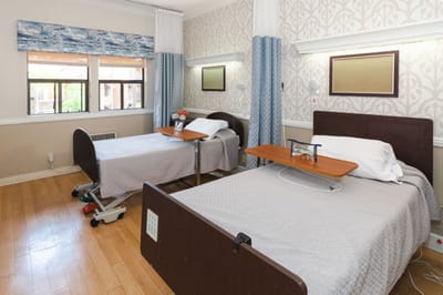 Cozy resident room with two beds and decorative accents