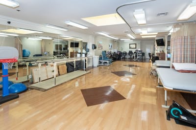 Rehabilitation room with gym equipment and exercise area