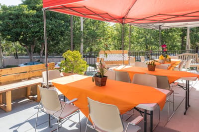 Outdoor patio area with tables and decorations