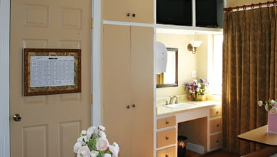 Interior view of a resident room with floral arrangements