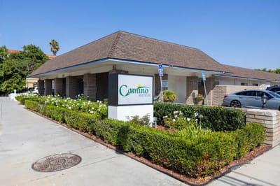 Exterior view of Camino Healthcare facility with landscaping