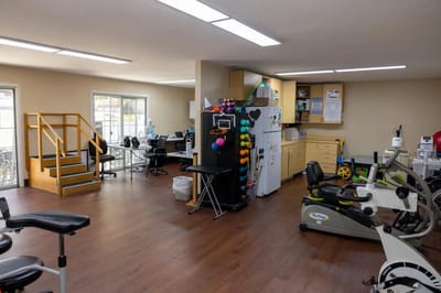 Therapy room with exercise equipment and medical supplies