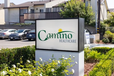 Facility sign displaying Camino Healthcare branding