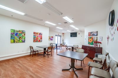 Bright common area with flowers on the walls