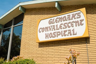 Exterior view of the Glenoaks Convalescent Hospital sign