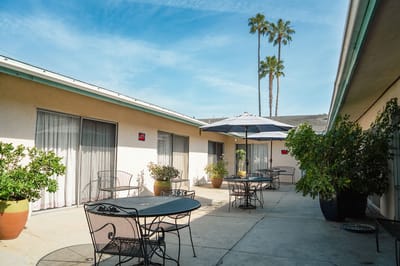 Outdoor patio area with tables and umbrellas