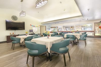 Dining room setup with tables and chairs