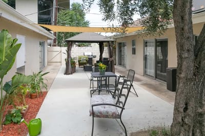 Outdoor seating area with gazebo and plants
