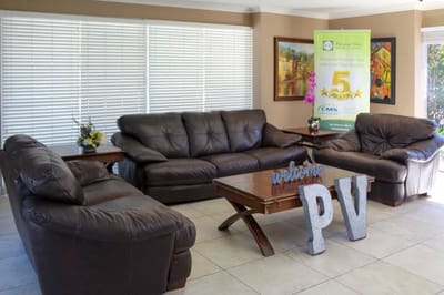 Common area seating with welcome sign