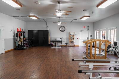 Interior view of a spacious therapy room with equipment