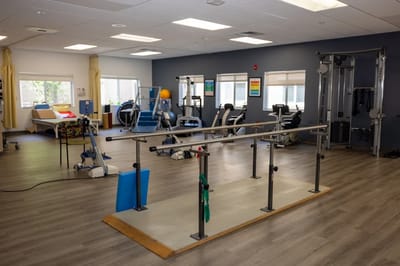 Interior view of a therapy gym with equipment