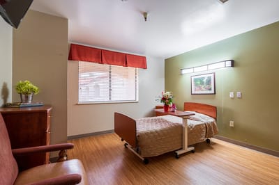 Private resident room with bed and decor