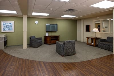 A common area with seating and a television
