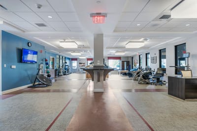Interior view of a therapy gym with exercise equipment