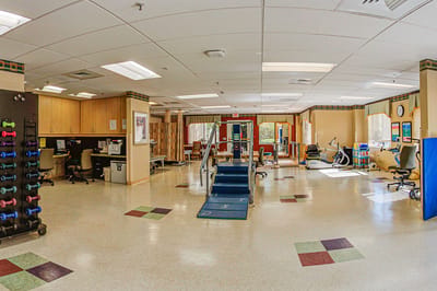 Physical therapy room with equipment and exercise area