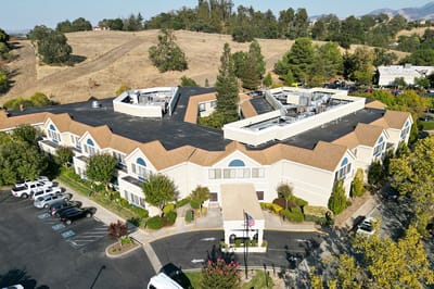 Aerial view of Rossmoor Post Acute facility with landscaping