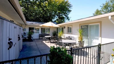 Outdoor patio area with seating and umbrellas