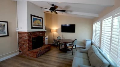 Cozy interior of a common area with seating and a fireplace