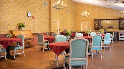 Dining area with round tables and floral centerpieces