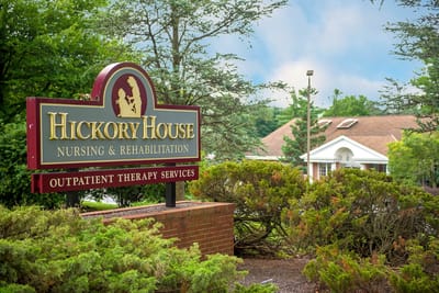 Sign of Hickory House Nursing & Rehabilitation in a landscaped area