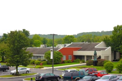 Exterior view of St. Martha Center surrounded by greenery