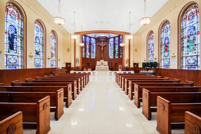 Interior view of a chapel with stained glass windows
