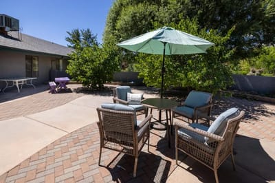 Outdoor seating area with umbrella and table