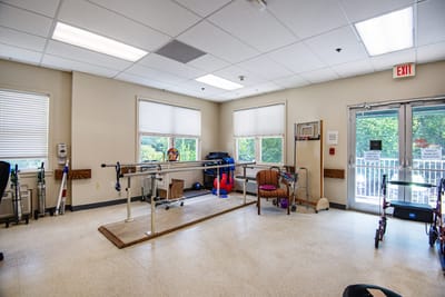 Rehabilitation room with exercise equipment and seating