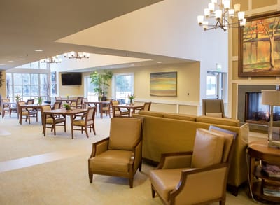 Bright common area with comfortable seating and art