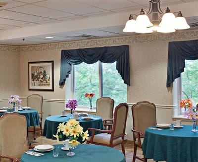 Bright dining room with tables set for meals