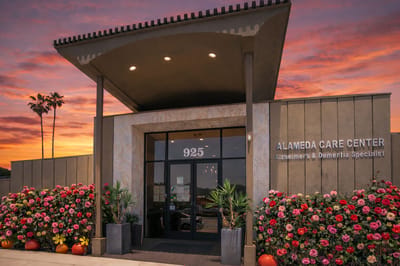 Exterior view of the Alameda Care Center at sunset