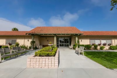Building entrance of Camarillo Healthcare Center with outdoor seating