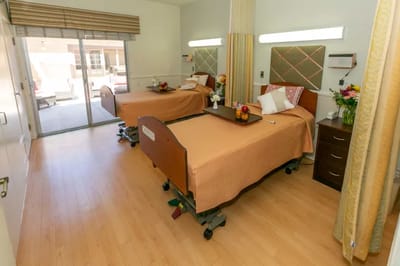 Spacious resident room with two adjustable beds