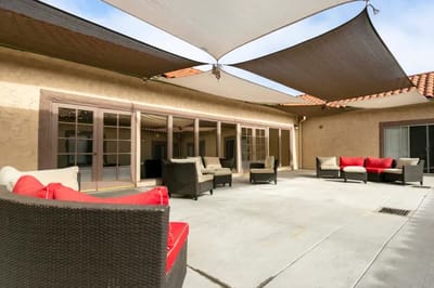 Outdoor seating area with shaded lounge chairs