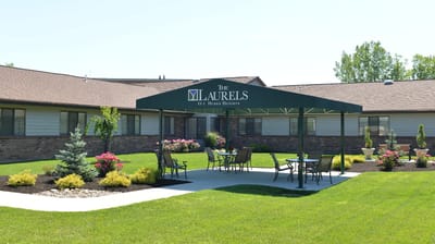 Outdoor seating area with a canopy at Laurels of Huber Heights