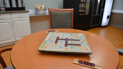 Scrabble game on a table in a common area