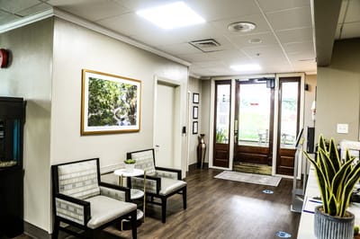 Bright lobby area with seating and plants