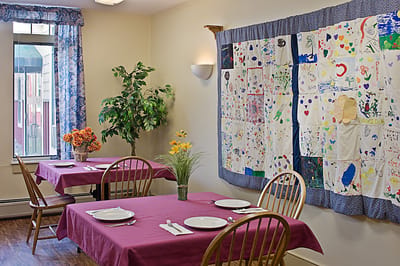 Interior dining area with decorated walls and tables