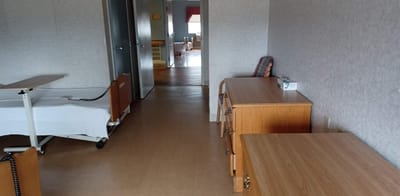 Interior view of a resident room with furniture