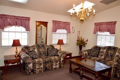 Cozy common area with floral decor and seating